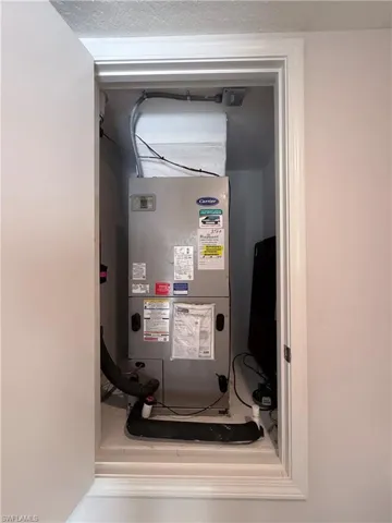 Utility room featuring heating unit