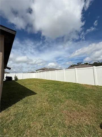 View of fenced backyard