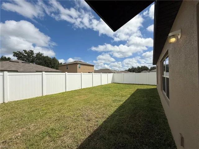 View of fenced backyard