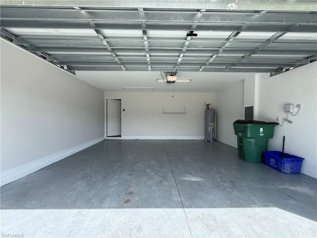 Garage with electric panel and water heater