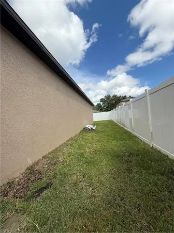 View of fenced backyard