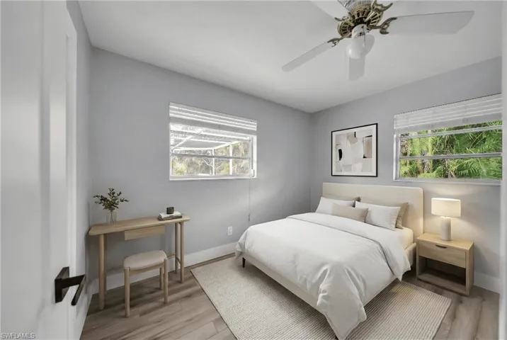 Bedroom featuring light wood-type flooring and ceiling fan