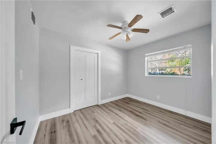 Spare room featuring light wood-type flooring and a ceiling fan