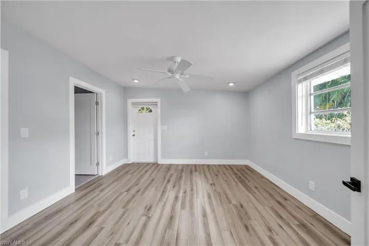 Unfurnished room featuring ceiling fan, light wood-type flooring, and recessed lighting