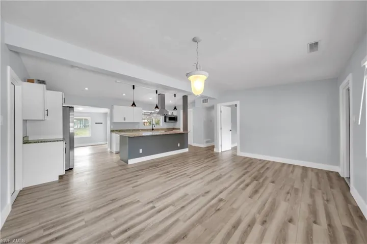Unfurnished living room featuring light wood-style floors and recessed lighting