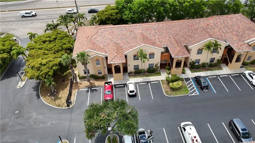 Multi-unit residential building featuring a tile roof and stucco exterior