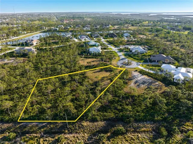 Aerial view of residential area featuring property parcel outlined