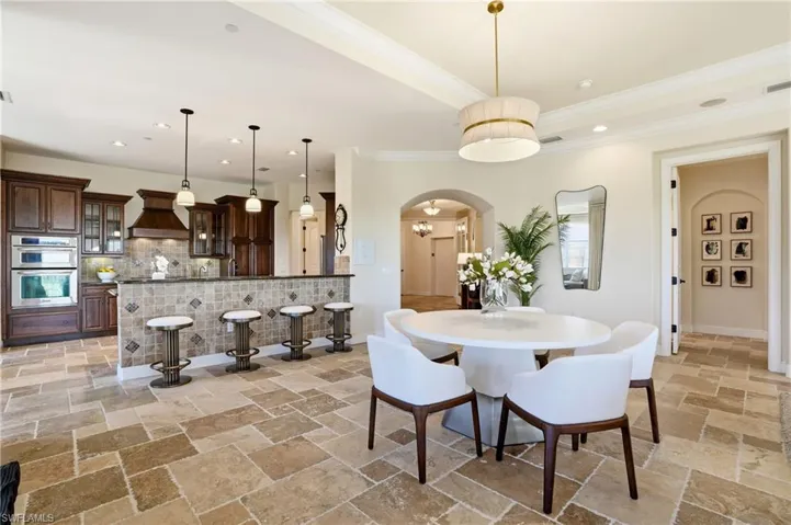 Formal dining, bar seating, and a breakfast sitting area allow many choice for food and fellowship