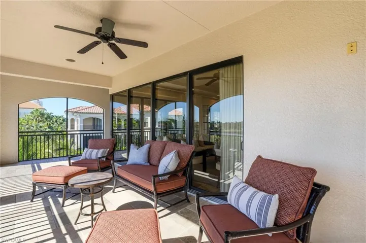The lanai features plenty of seating and different vantage points to take in the views of the golf course and Ritz Carlton Resort as part of Tiburon Golf Resort