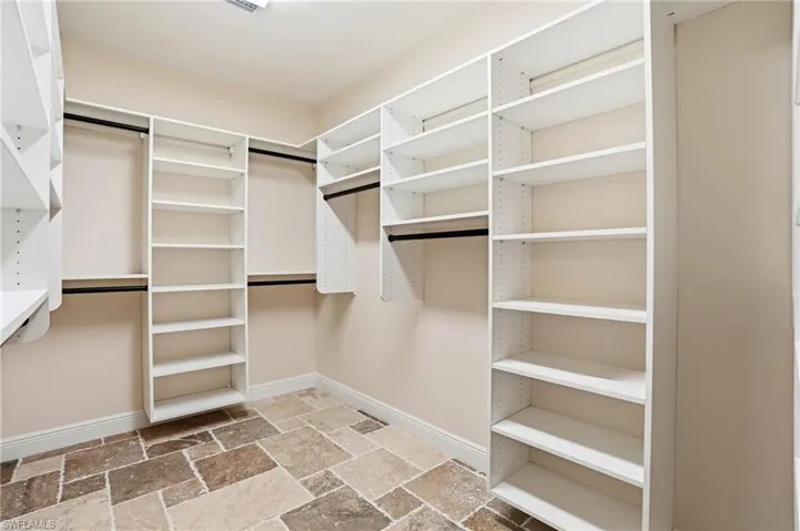 The primary closet is large and customized