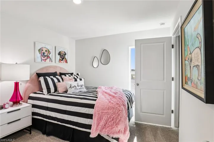 Model home. View of carpeted bedroom