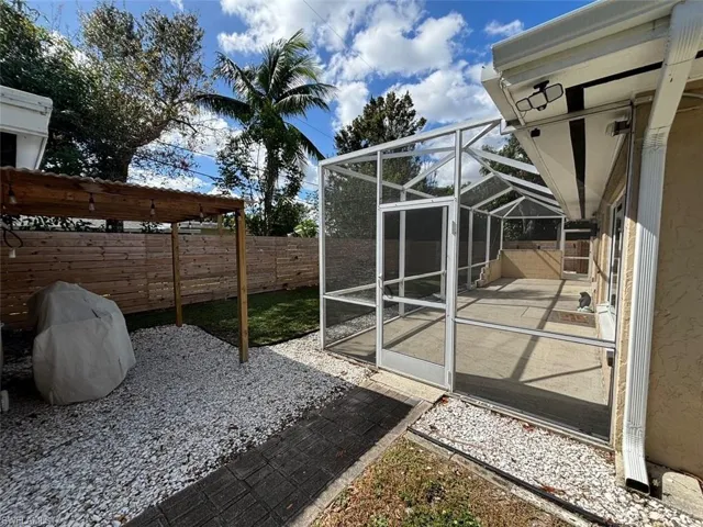 View of yard with a patio and a lanai
