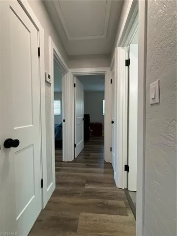 Hallway featuring dark hardwood / wood-style floors