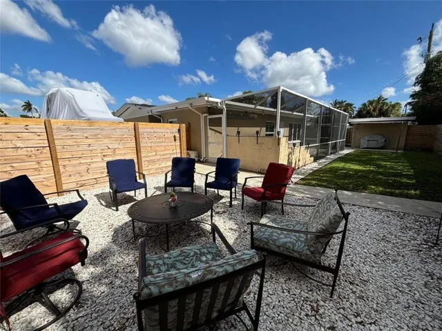 View of patio featuring a lanai