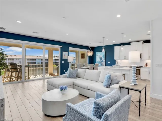 Living area with light wood-style floors, visible vents, and recessed lighting