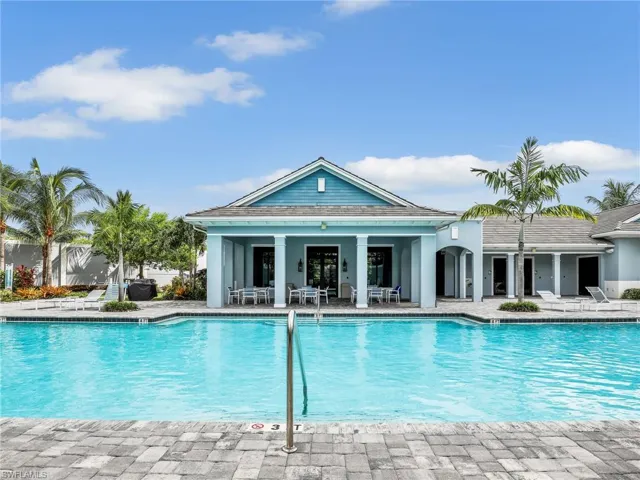 Pool featuring a patio and fence
