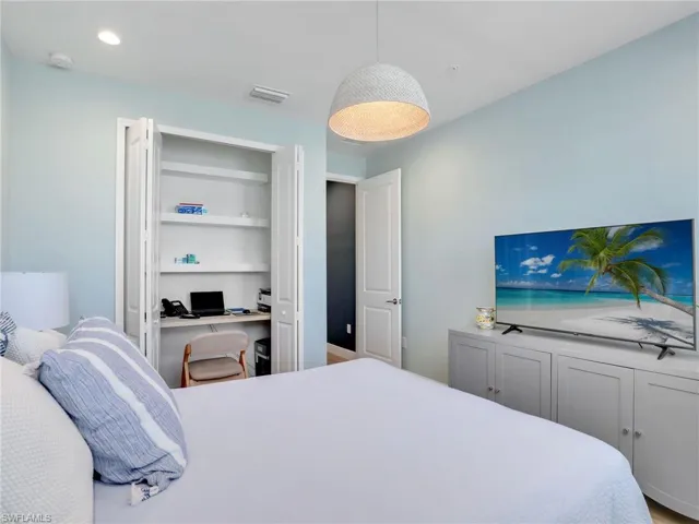 Bedroom featuring recessed lighting, visible vents, and built in desk