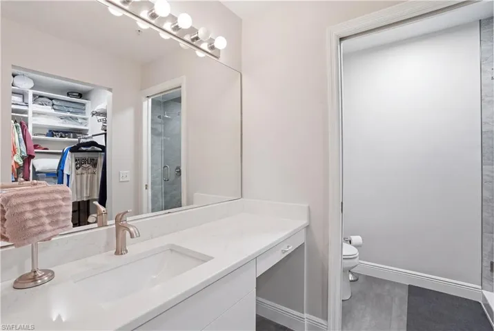 En-suite primary bathroom with ample counterspace.
