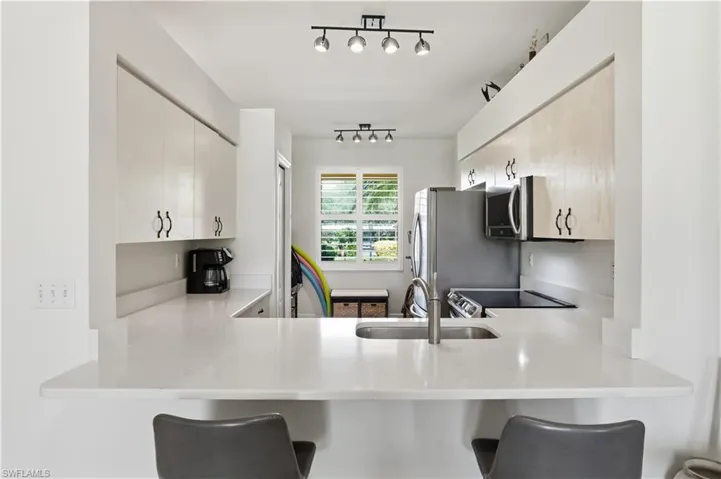 Kitchen opens to living area - prepare meals while entertaining guests.