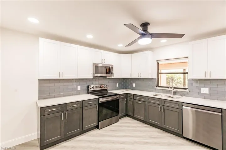 Remodeled kitchen with stainless appliances, granite and backsplash