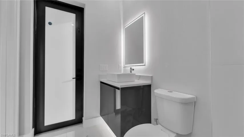 Bathroom featuring vanity and toilet