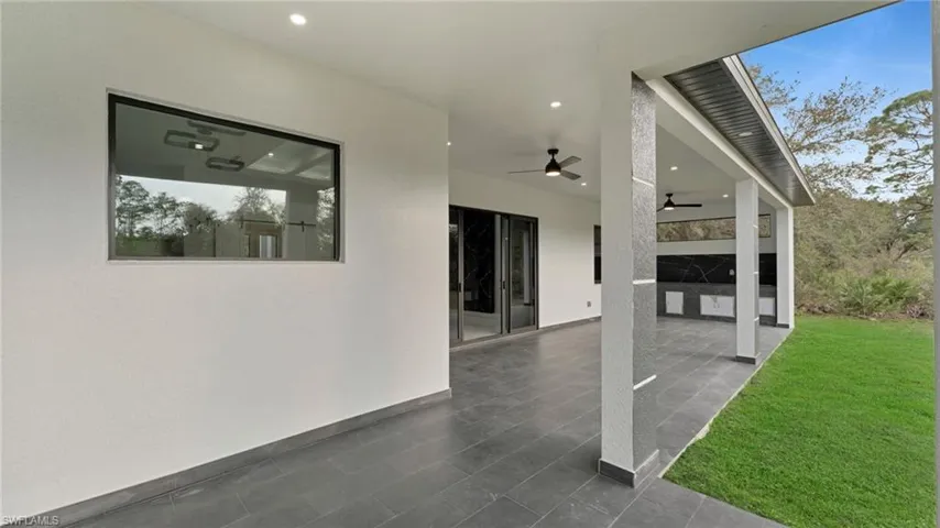 View of patio with a ceiling fan