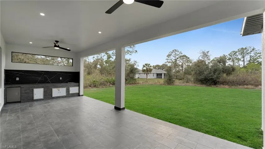 View of patio / terrace featuring an outdoor kitchen and ceiling fan
