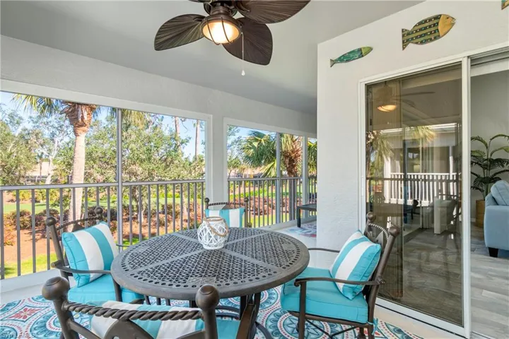 Sunroom featuring a wealth of natural light and a ceiling fan