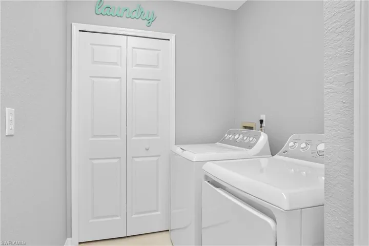 Laundry room featuring laundry area and separate washer and dryer