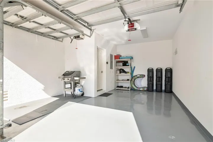 Garage featuring a garage door opener
