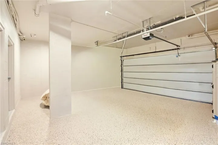 Garage featuring a garage door opener