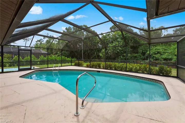 Pool overlooking peaceful , private back yard