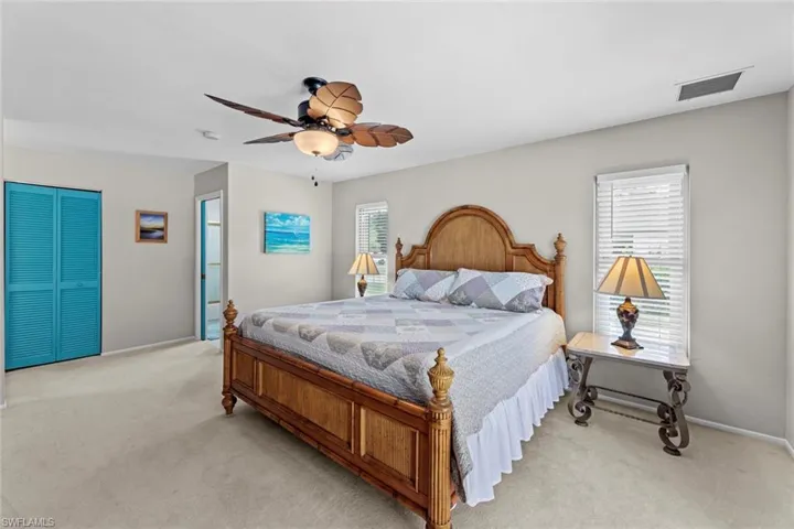 Master suite, walk-in closet behind folding blue door
