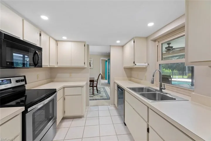 Kitchen w/serving window to lanai on right