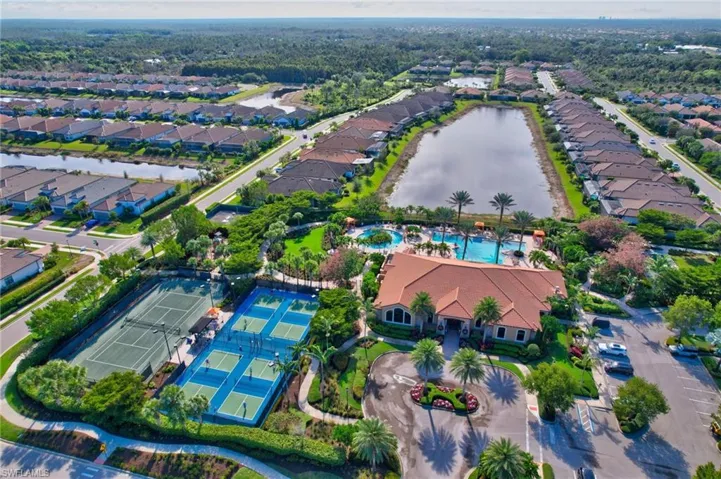 View of property location featuring a large body of water and nearby suburban area