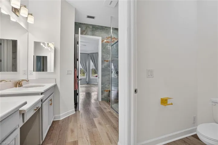 Bathroom with vanity and light wood-style flooring