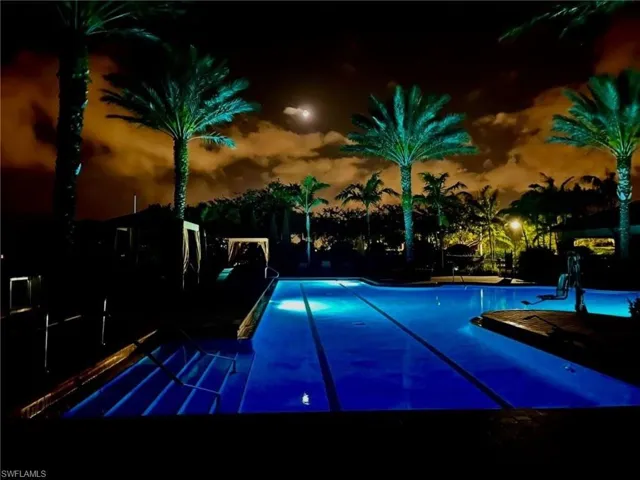 Community pool with a patio area
