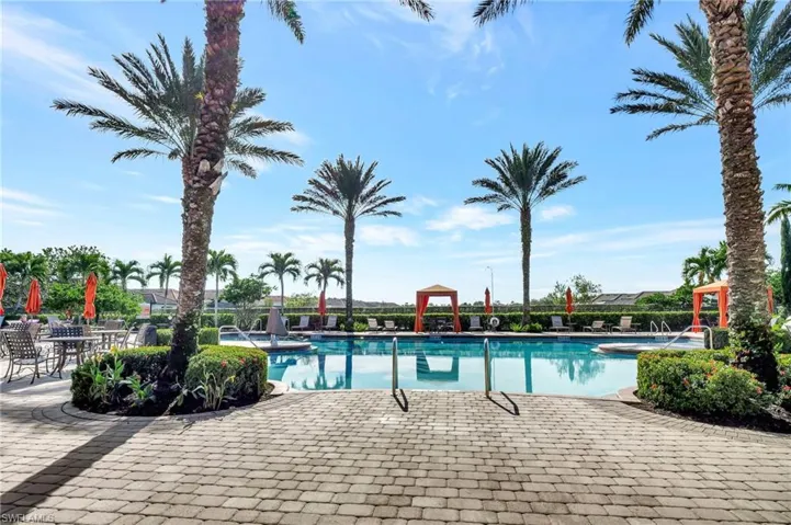 Community pool with a patio area