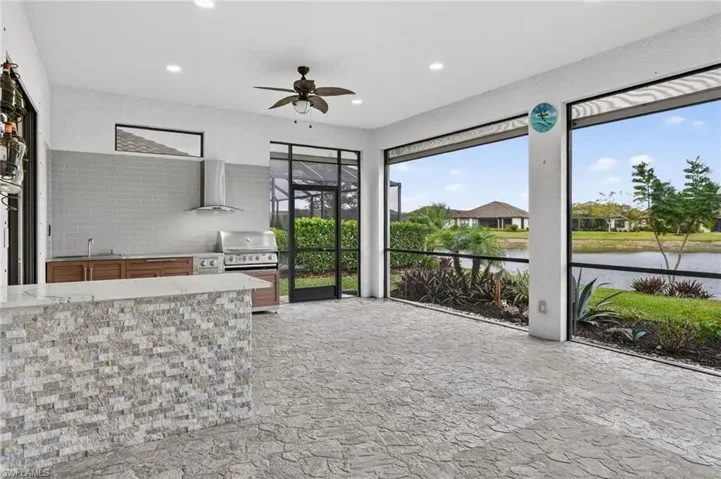 Unfurnished sunroom with a water view and a sink