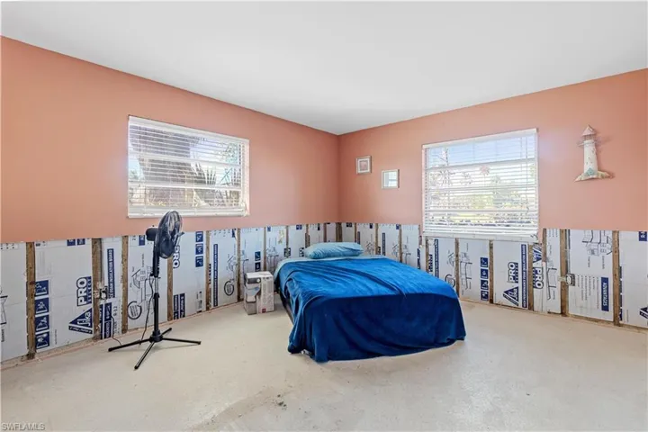 Bedroom featuring multiple windows