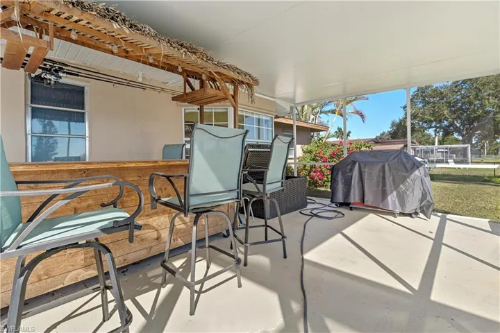 View of patio / terrace with grilling area and exterior bar