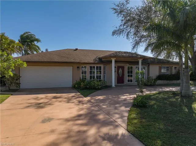 Single story home with a garage