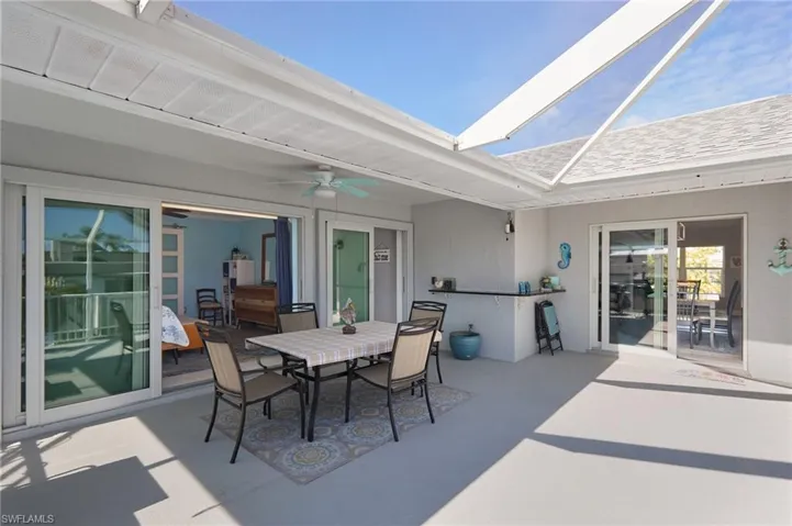 View of upper deck area.  Sliders to the left into MBR, to the right into the living kitchen areas