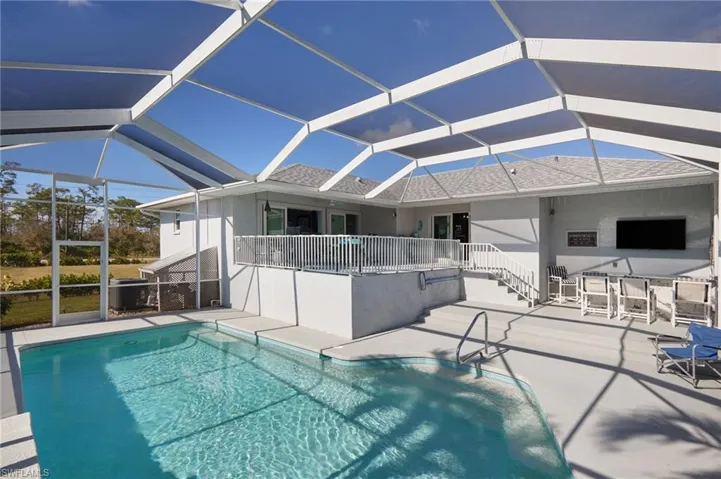 View of pool, upper deck and pool bar area.