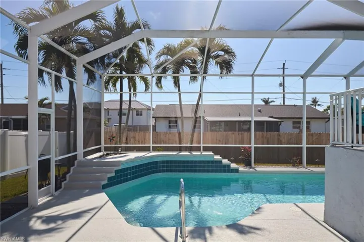 View of pool, lanai and patio