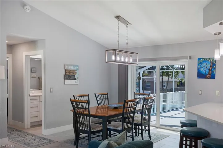 Dining area featuring sliders to upper deck; 2nd bath with entry to deck too!