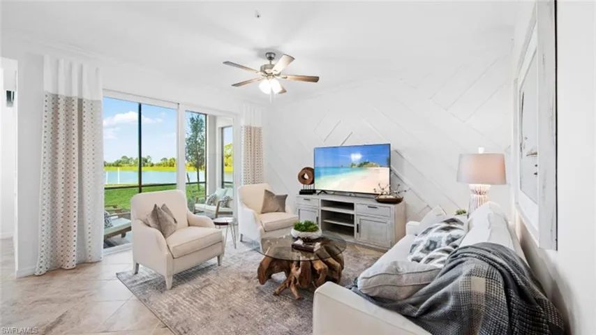 Tiled living room featuring ceiling fan, wood walls, and ornamental molding