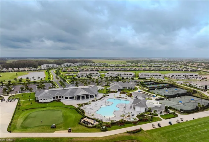 Aerial view featuring golf course view and a residential view