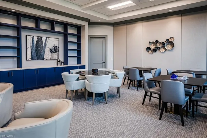 Dining area featuring a paneled ceiling and carpet flooring