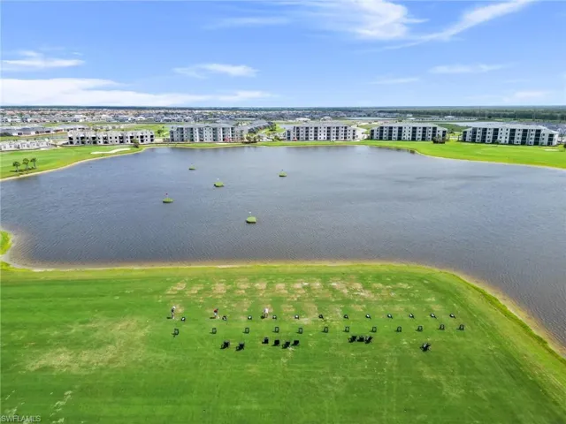 Birds eye view of property featuring a water view